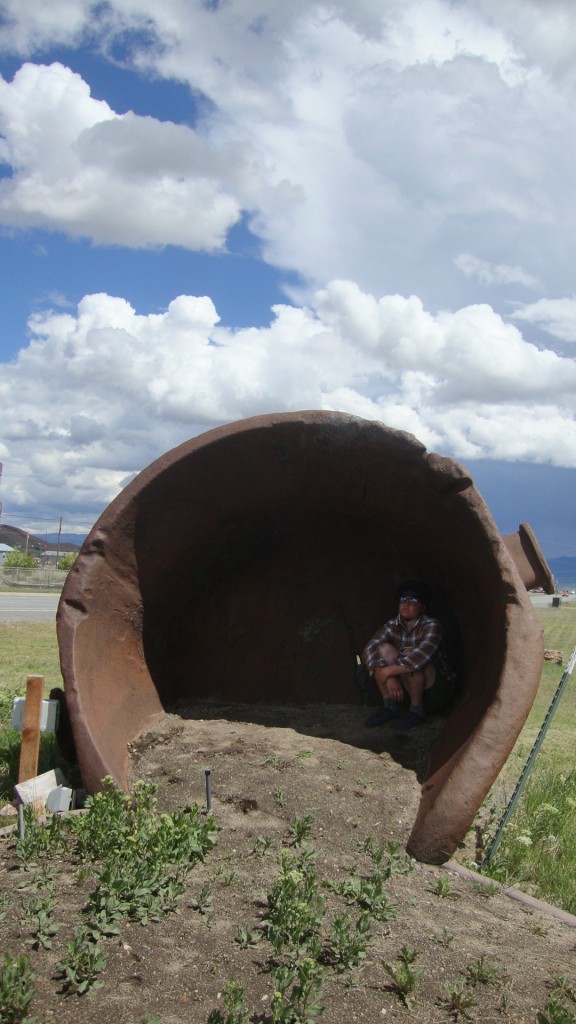 Stink looking like a cave troll in a huge iron bucket used for Butte's mining/smelting industry.