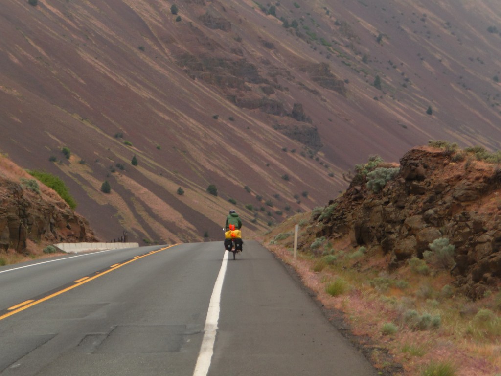 Cyclist riding down a mountain