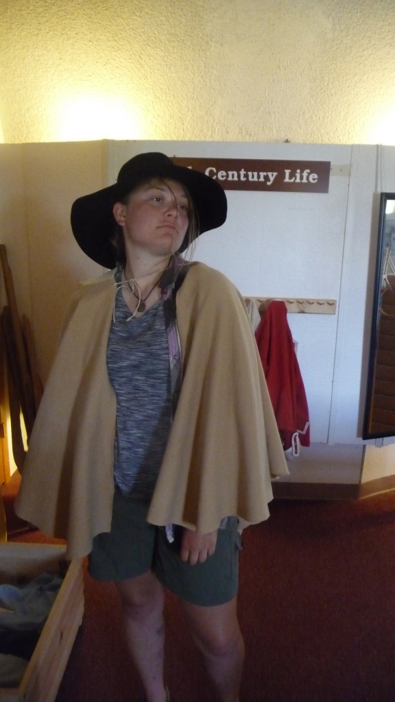 Cornhead tries on some historic garb. She just looks more homeles.