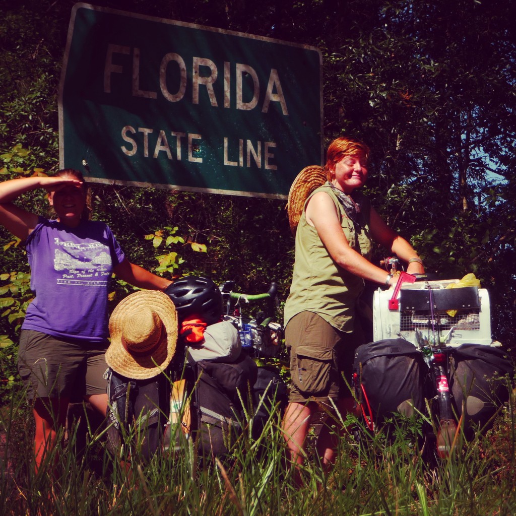 standing in front of the Florida sign