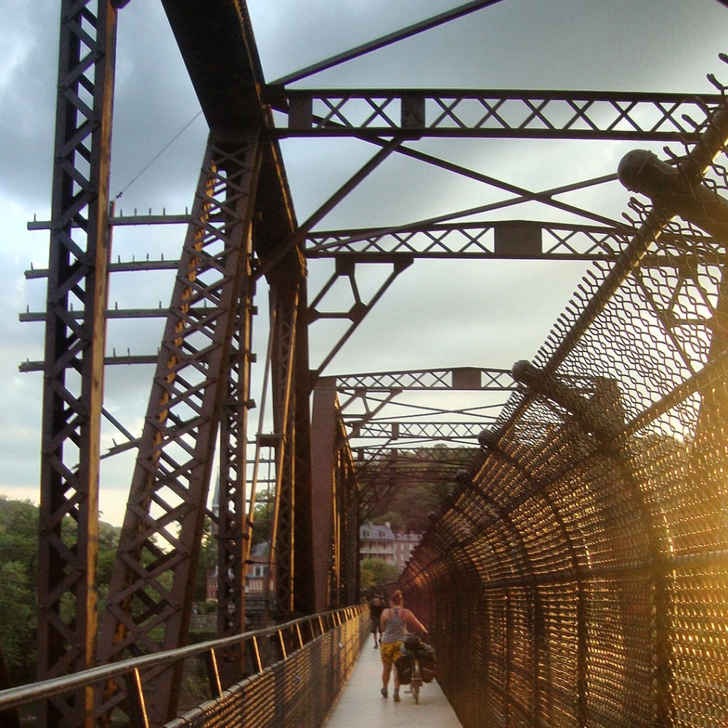 dismounted and walking across the bridge
